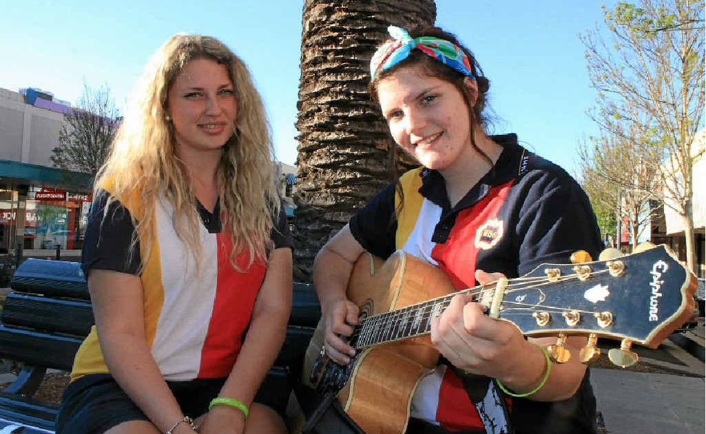 Amy Battison and Alice Morrissey warm up before the busk off yesterday afternoon, organised by Headspace.